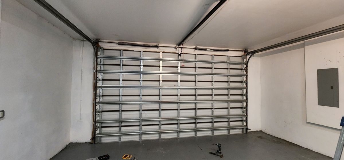 Newly installed garage door with hardware, interior view